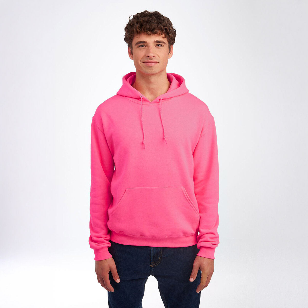 Man wearing a Jerzees NuBlend unisex hooded sweatshirt in neon pink.