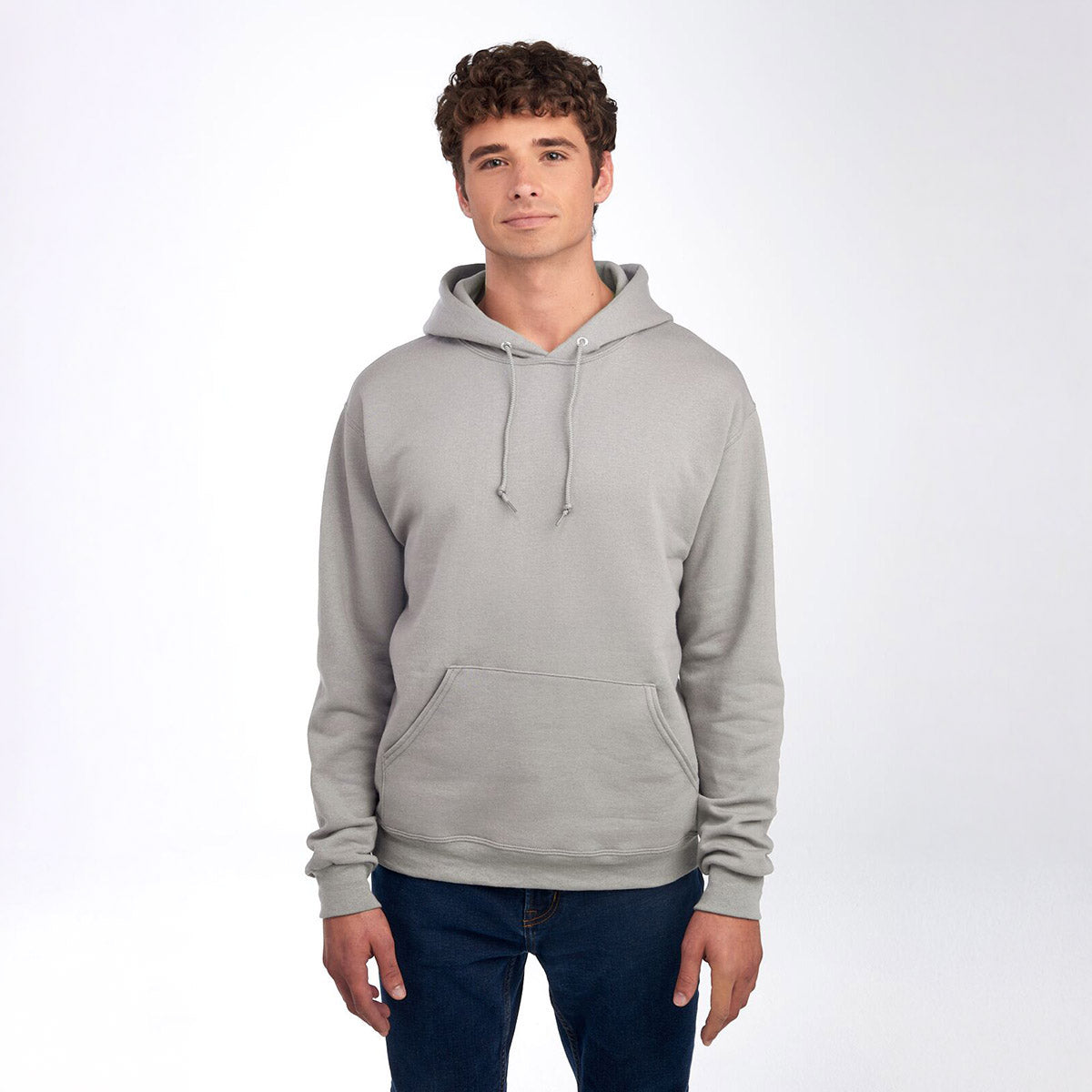 Man wearing a Jerzees NuBlend Unisex Hooded Sweatshirt in the color Rock.