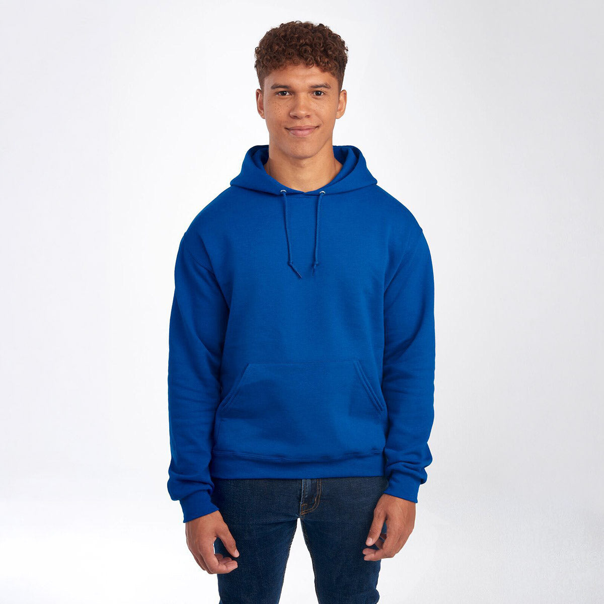 A man wearing a royal blue Jerzees NuBlend unisex hooded sweatshirt against a plain white background.