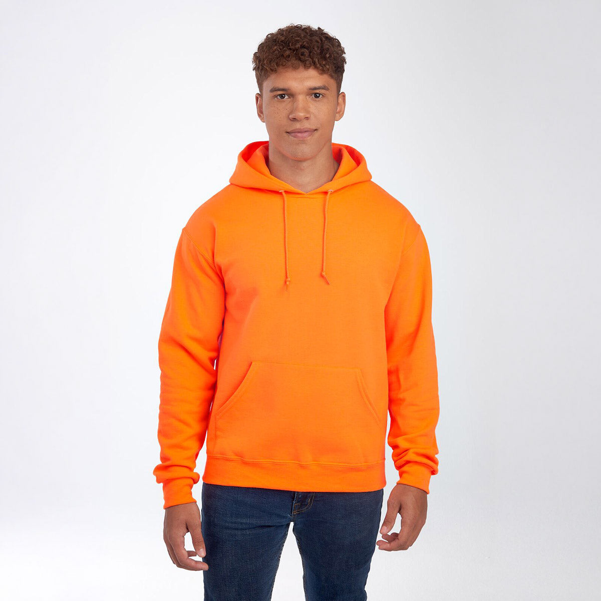 A man wearing a Safety Orange Jerzees NuBlend Unisex Hooded Sweatshirt against a white background.
