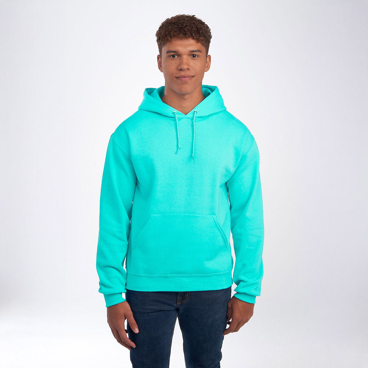 Man wearing a Scuba Blue Jerzees NuBlend® Unisex Hooded Sweatshirt against a white background.