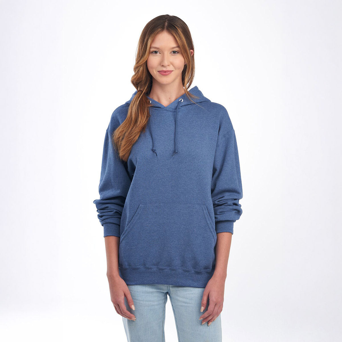 Woman wearing a Jerzees NuBlend Unisex Hooded Sweatshirt in Vintage Heather Blue.