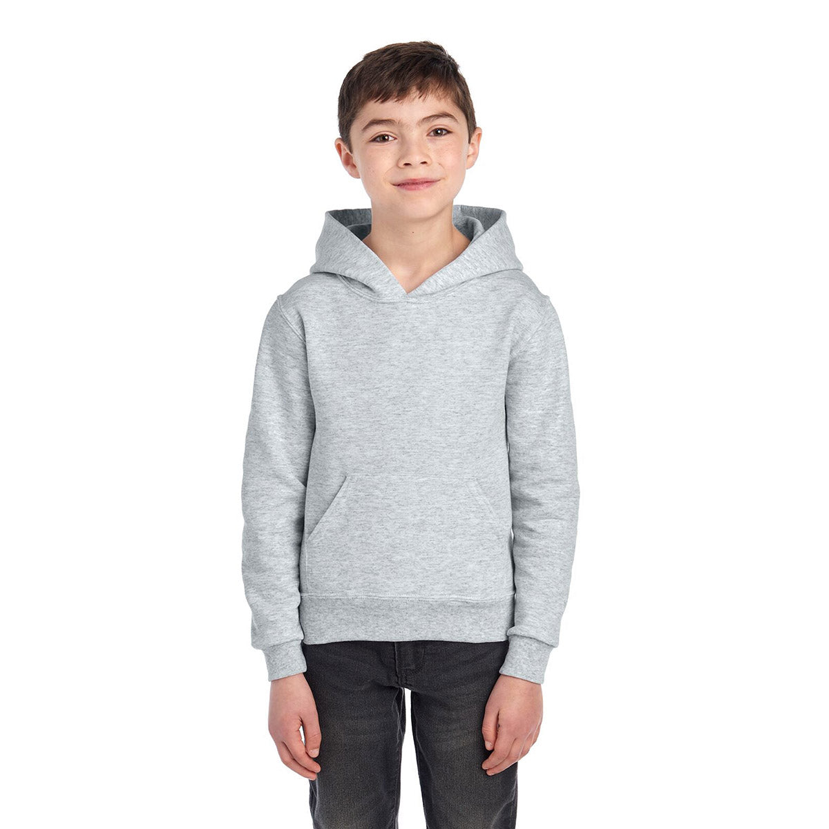 A young boy wears an Ash Jerzees NuBlend® Youth Hooded Sweatshirt against a white background.