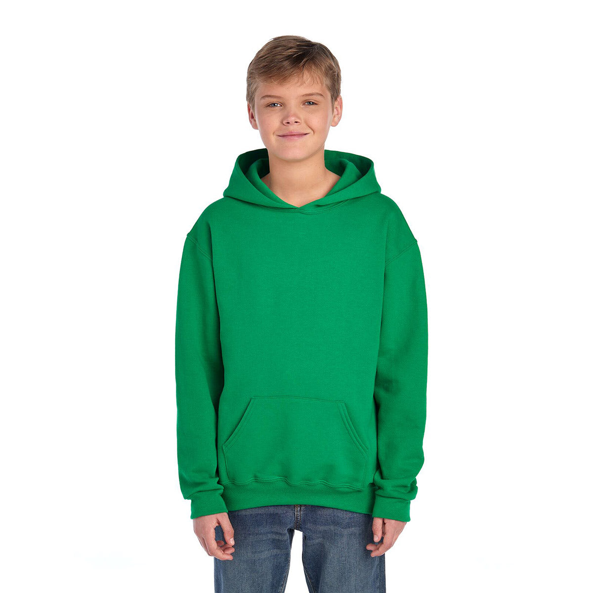 A young boy wearing a Kelly green Jerzees NuBlend Youth Hooded Sweatshirt against a white background.