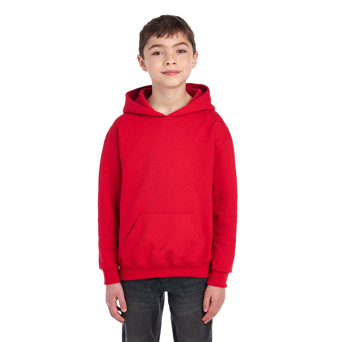 Youth model wearing a True Red Jerzees NuBlend® Youth Hooded Sweatshirt against a white background.