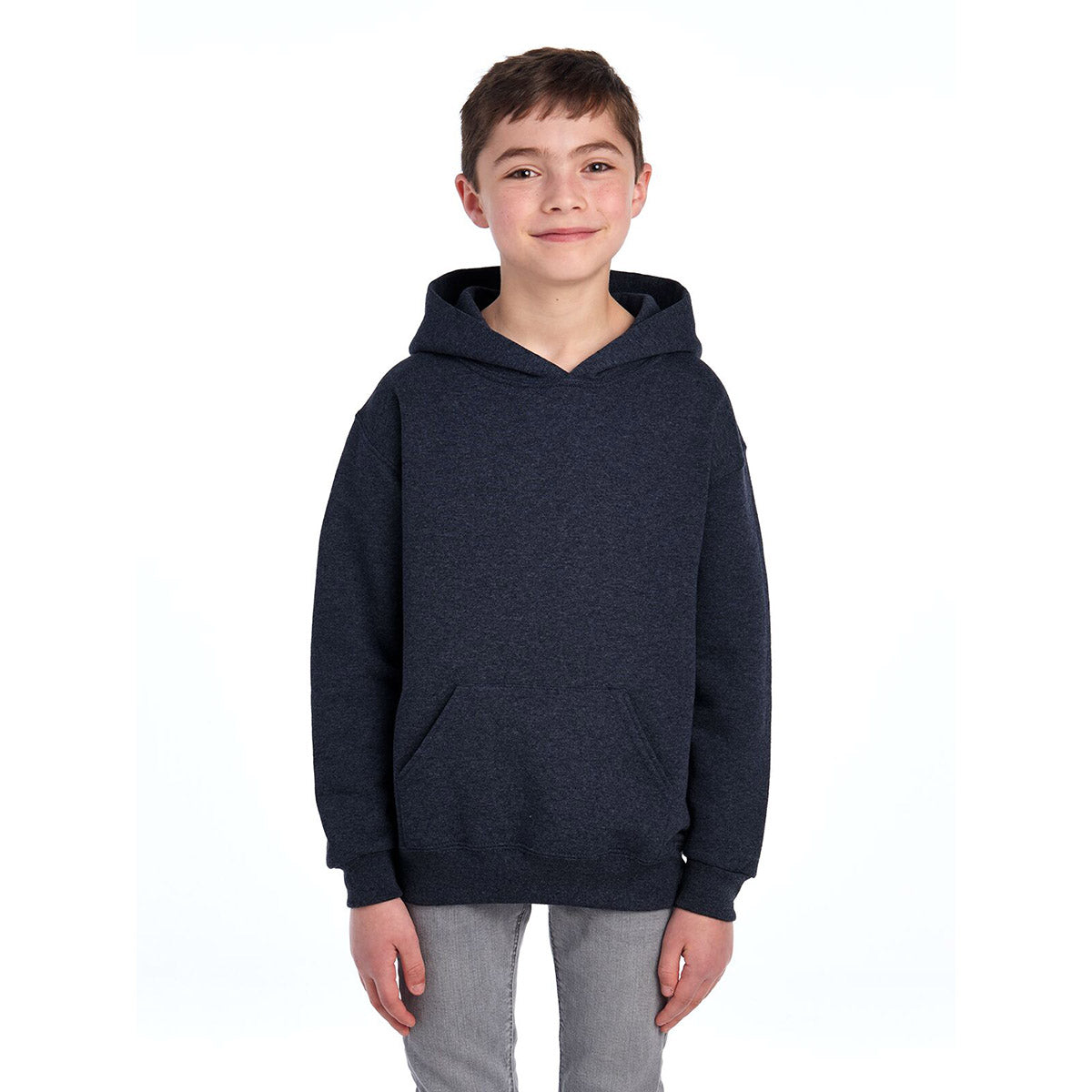 A young boy wearing a Vintage Heather Navy Jerzees NuBlend® Youth Hooded Sweatshirt against a white background.