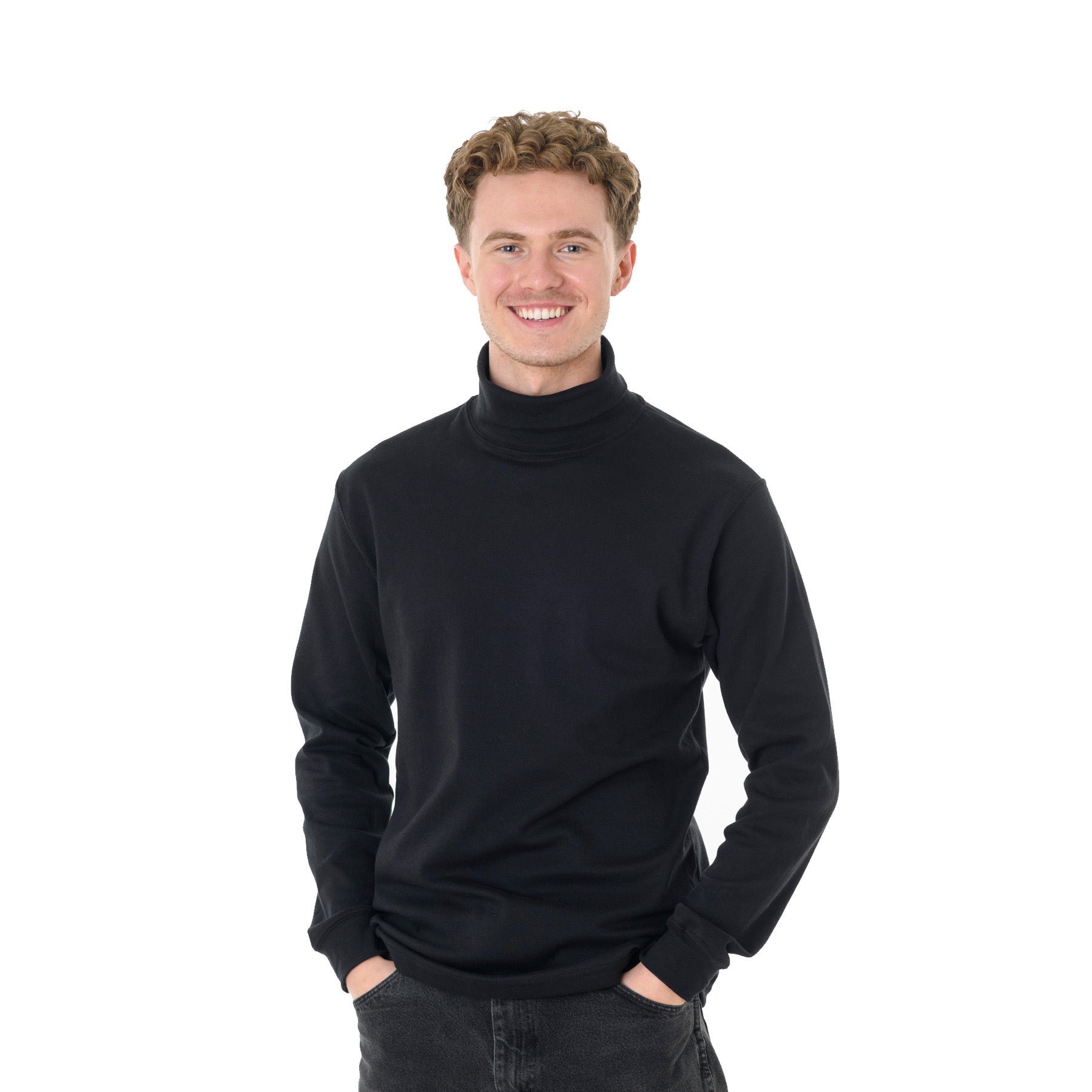 A man smiling while wearing a black King Athletics long-sleeve turtleneck shirt.