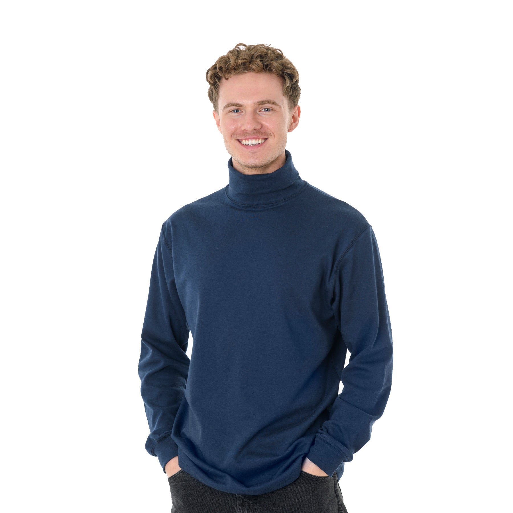 King Athletics navy long sleeve turtleneck shirt worn by a smiling man with curly hair, hands in pockets.