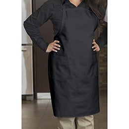 A person wearing a Premium Uniforms black designer bib apron with front pockets.