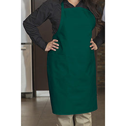 Premium Uniforms designer hunter green bib apron with pockets worn over a black shirt.