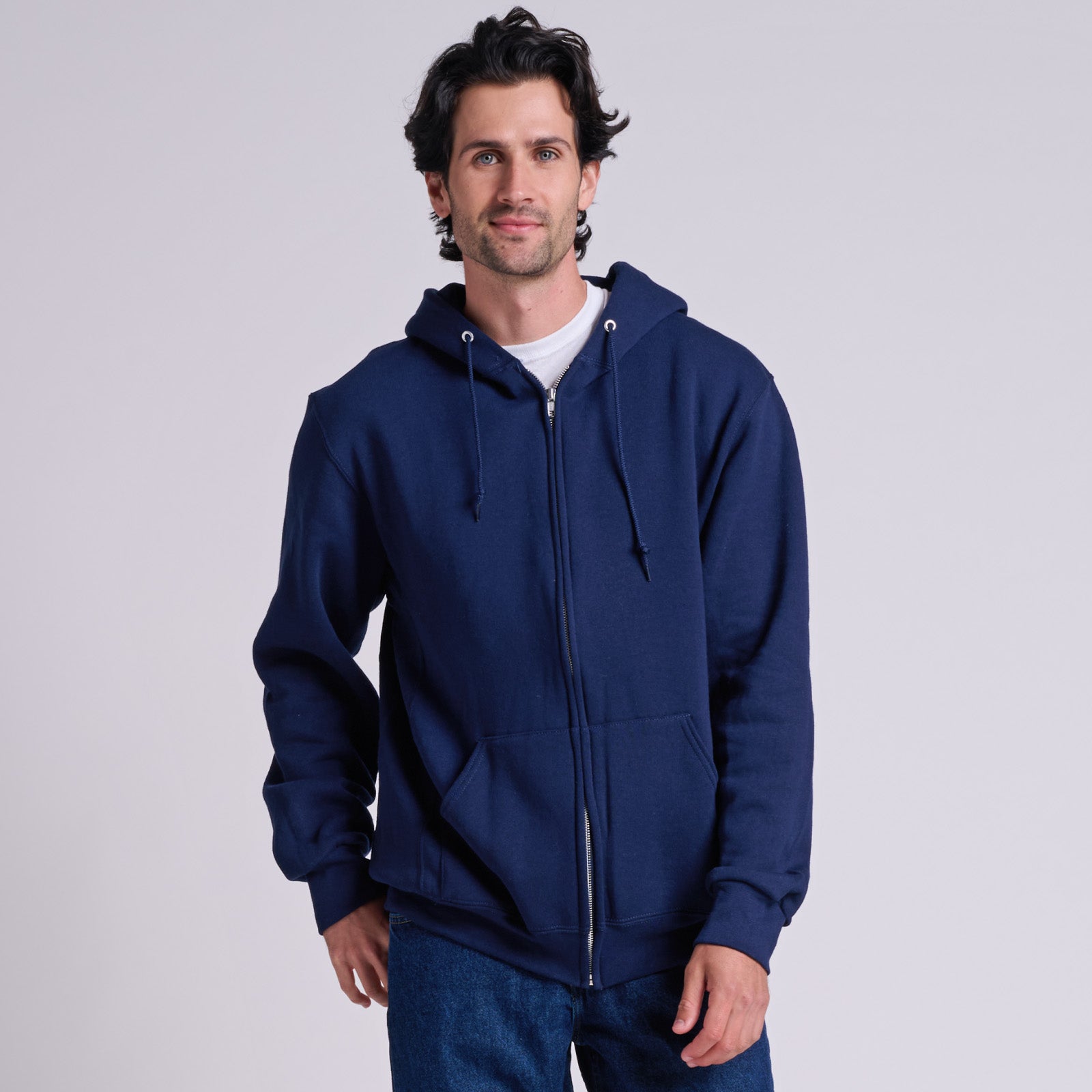 Man wearing a Russell Athletic DRI-POWER Adult Fleece Full-Zip Hoodie in navy.